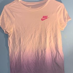 From nike a very nice pop of purple, t-shirt. Size is a Large in kids